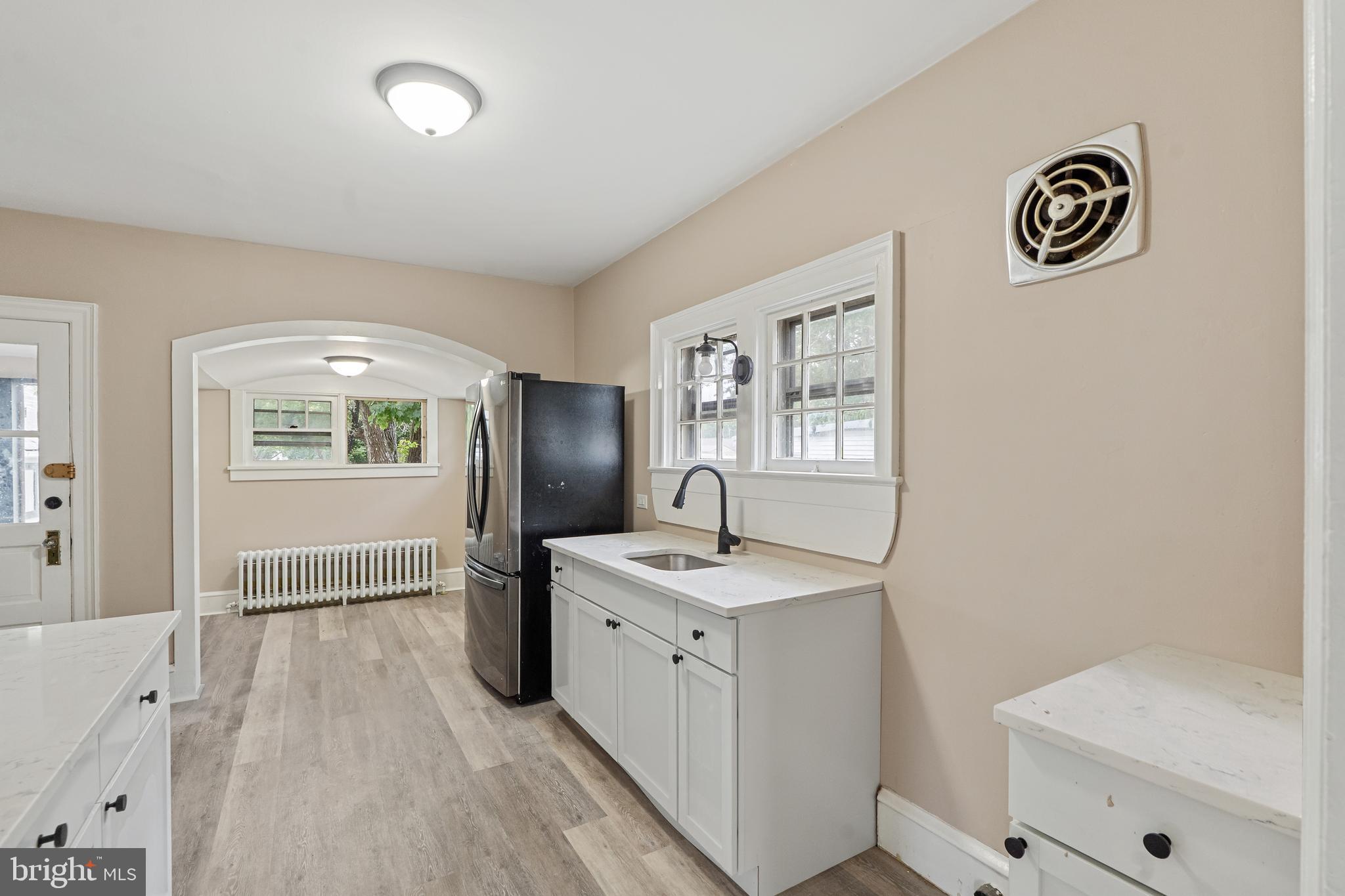 414 Main Street Dorchester, NJ 08316 - Photo 7 of 22 a view of a bathroom with baby crib and a wooden floor