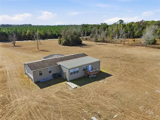 a view of a lake with houses in the back