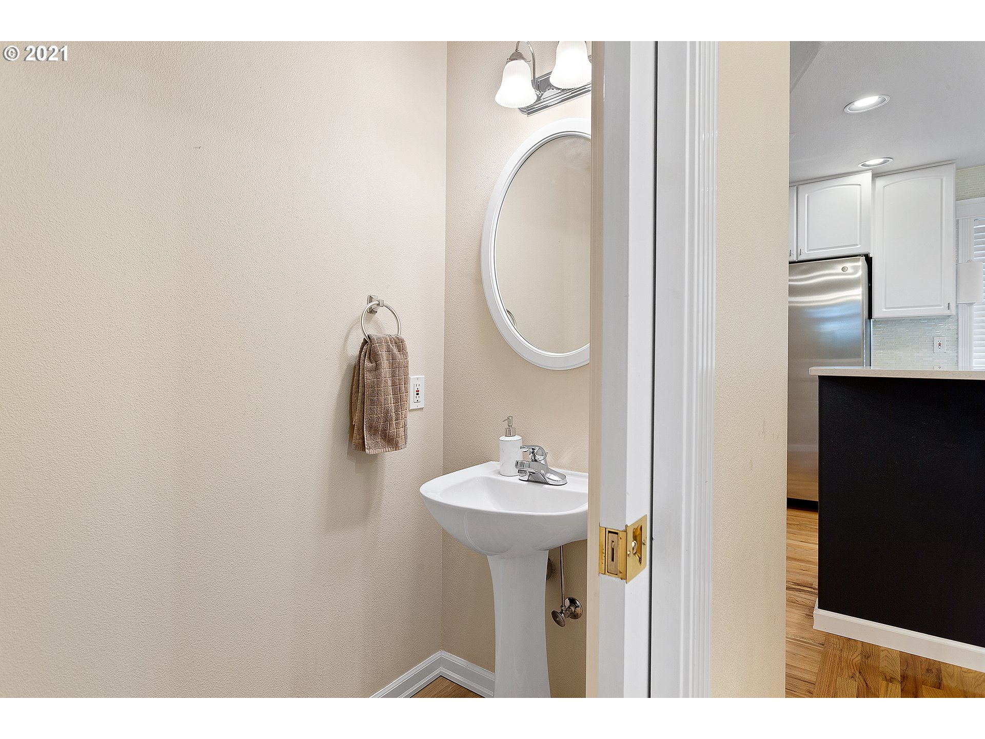 4930 Southwest 1st Avenue Portland, OR 97239 - Photo 12 of 27 a bathroom with a sink vanity and a mirror