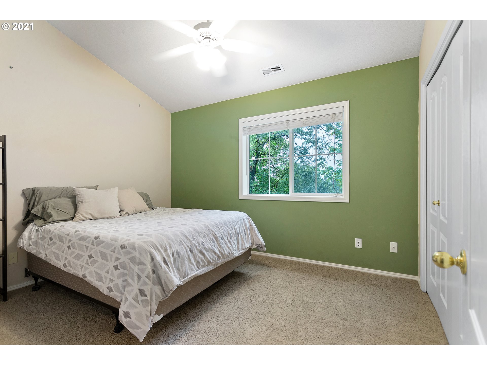4930 Southwest 1st Avenue Portland, OR 97239 - Photo 16 of 27 a bedroom with a bed and a window