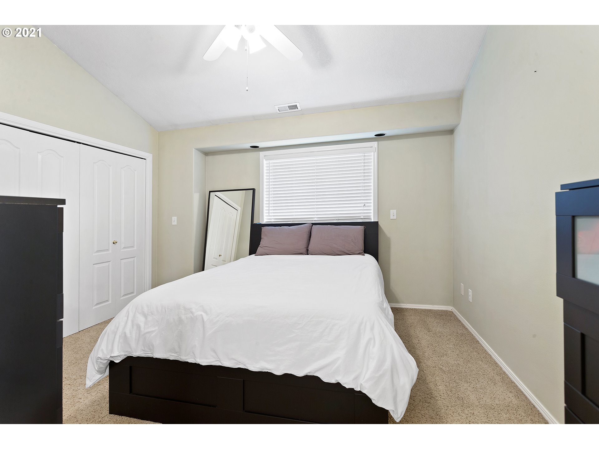 4930 Southwest 1st Avenue Portland, OR 97239 - Photo 20 of 27 a bedroom with a bed and wooden floor