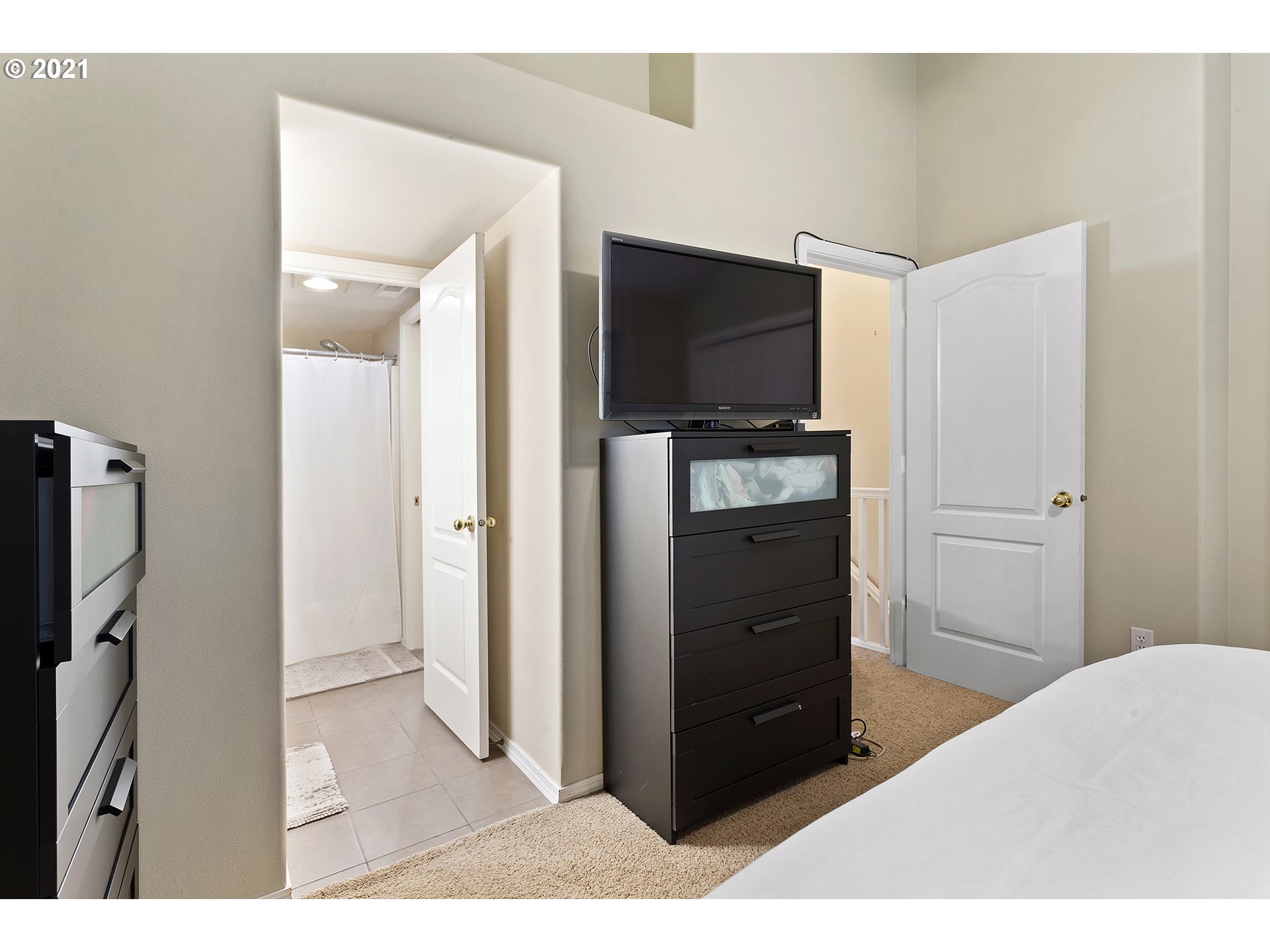 4930 Southwest 1st Avenue Portland, OR 97239 - Photo 22 of 27 a living room with a flat screen tv and refrigerator