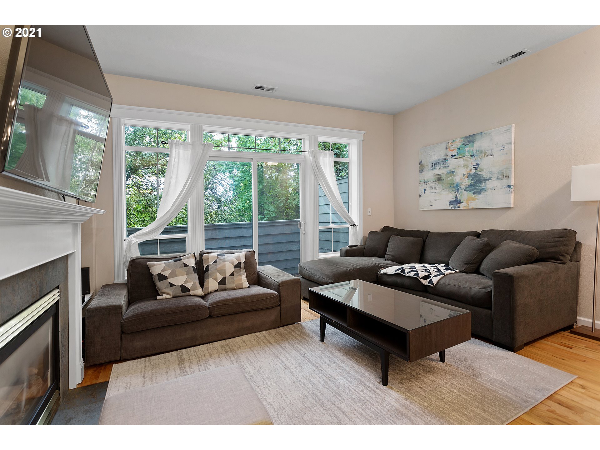4930 Southwest 1st Avenue Portland, OR 97239 - Photo 5 of 27 a living room with furniture and a fireplace
