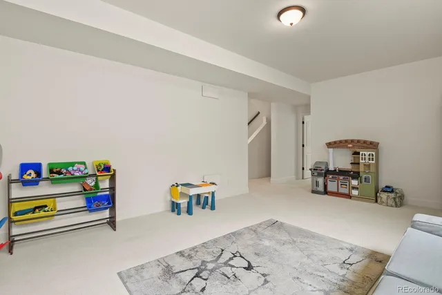 a room with toys and a wooden floor