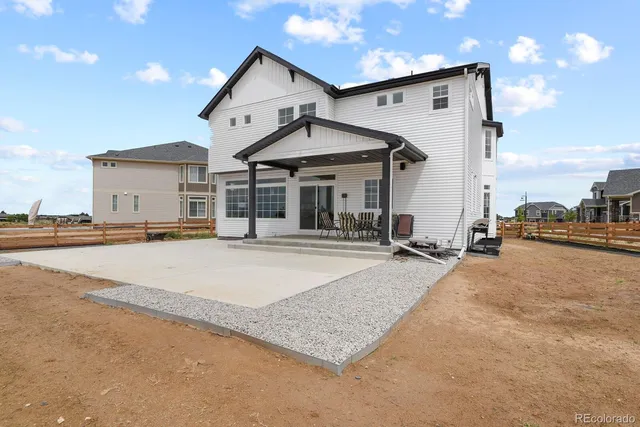 a view of a house with sitting area and roof
