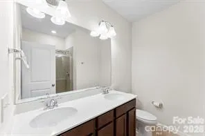 a bathroom with a sink vanity and a mirror