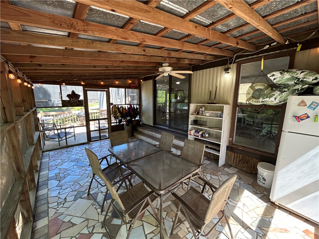 43 Sunset Cove Road Abbeville, SC 29620 - Photo 22 of 41 This inviting porch offers a relaxing retreat with ample space for outdoor dining and entertaining.