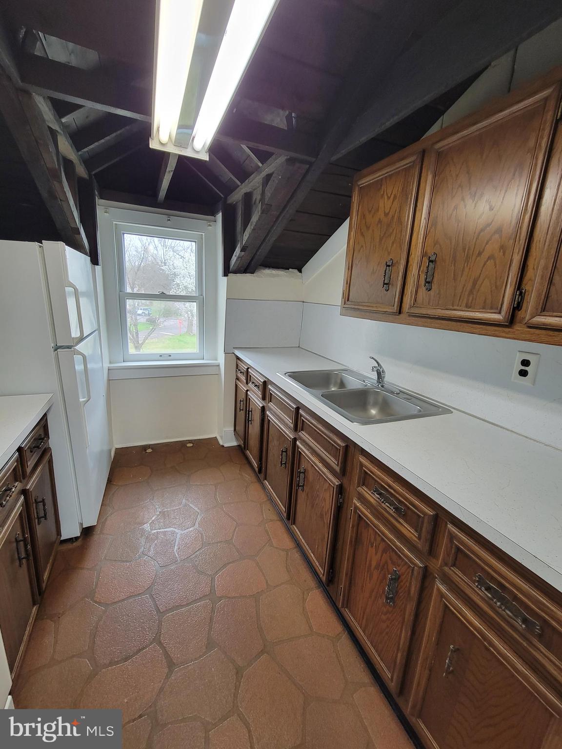 110 Gumbes Road Oaks, PA 19426 - Photo 12 of 24 a kitchen with a sink a stove cabinets and a window