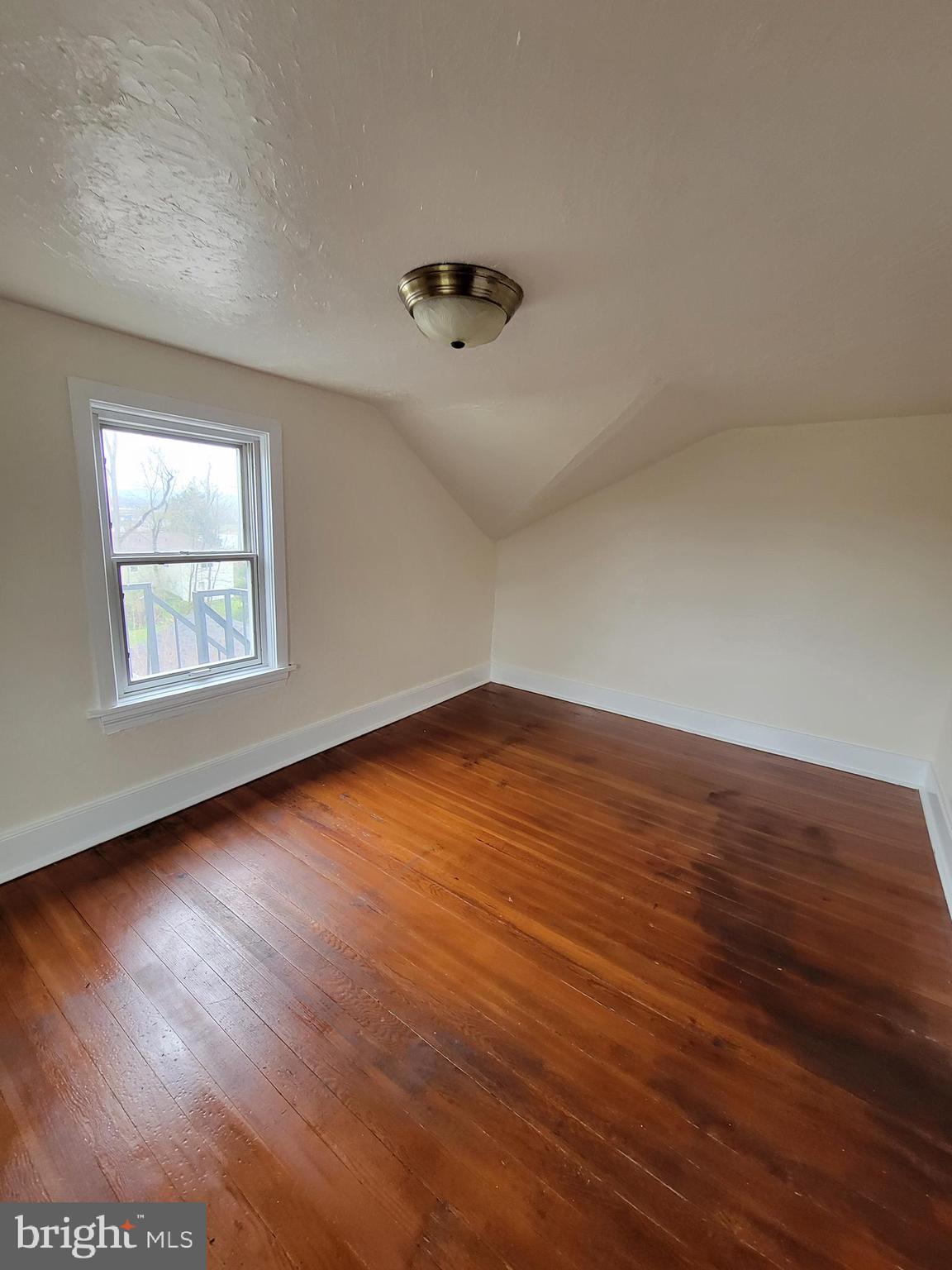 110 Gumbes Road Oaks, PA 19426 - Photo 14 of 24 an empty room with wooden floor and windows