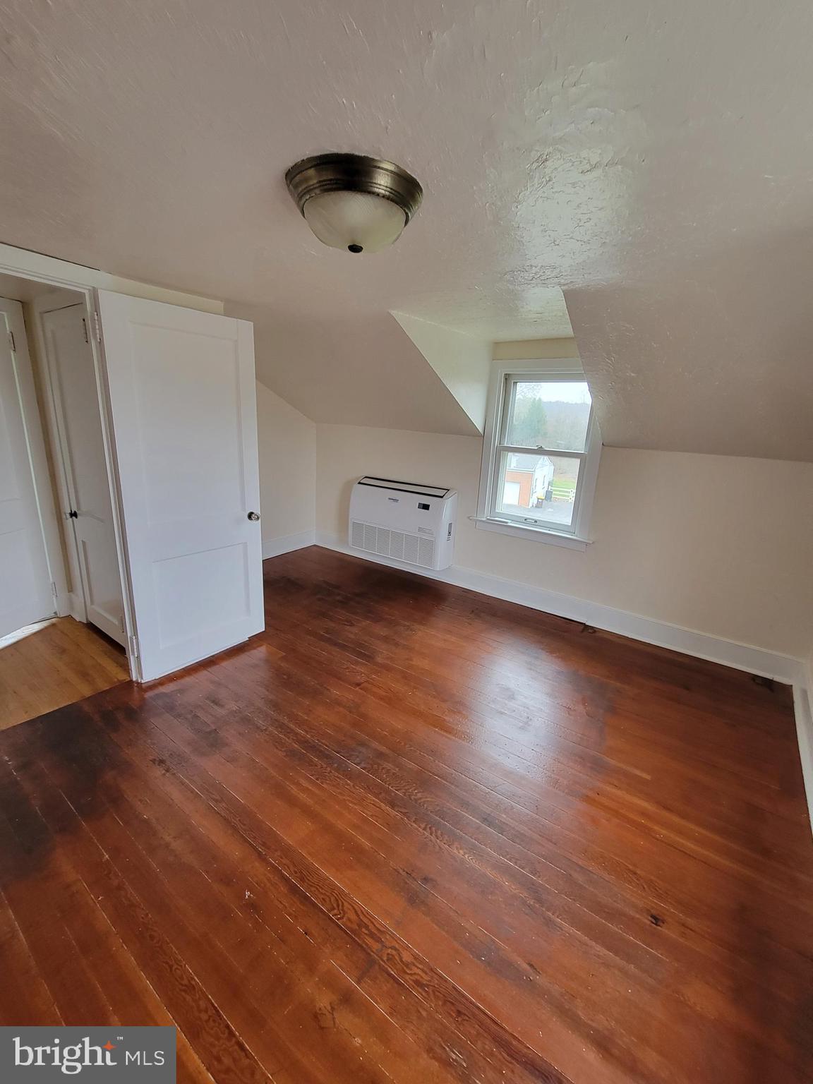 110 Gumbes Road Oaks, PA 19426 - Photo 15 of 24 an empty room with wooden floor and windows