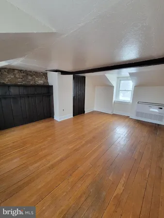 a view of a big room with wooden floor