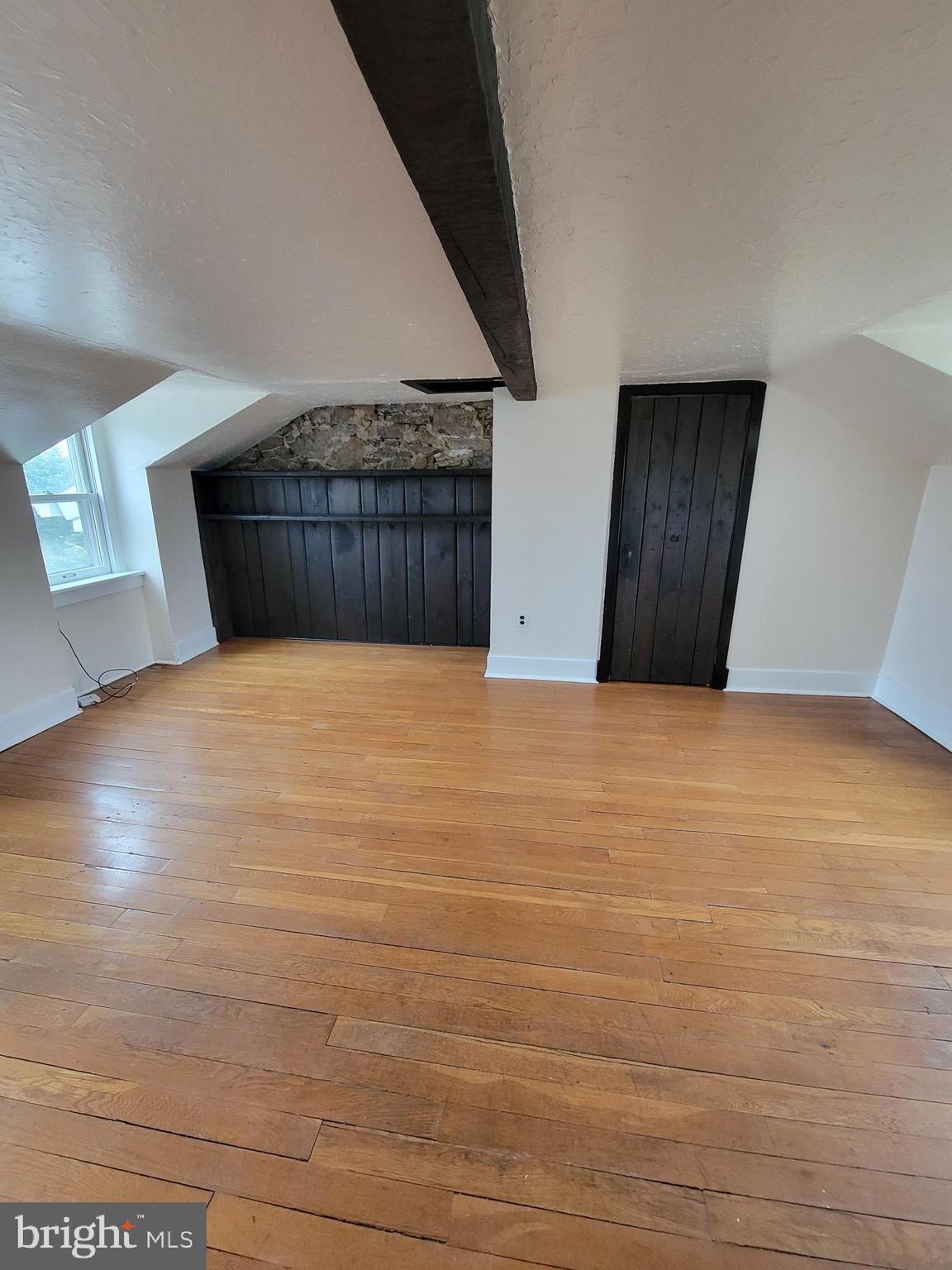 110 Gumbes Road Oaks, PA 19426 - Photo 4 of 24 a view of an empty room with wooden floor