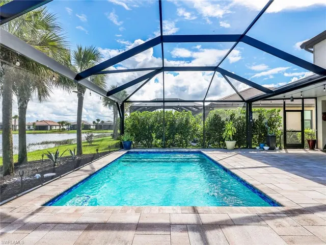 a view of swimming pool with a patio