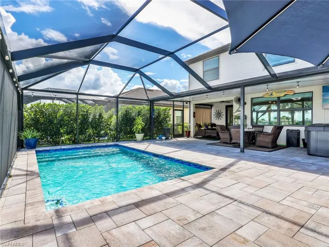 a view of swimming pool with a patio