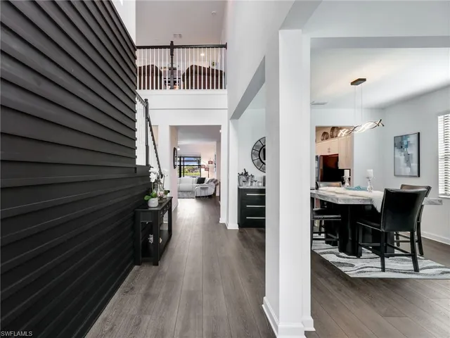 a view of a hallway with seating area