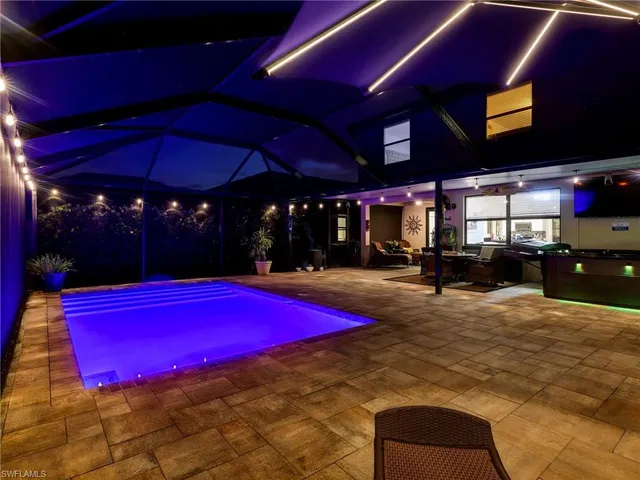 a view of swimming pool with a patio