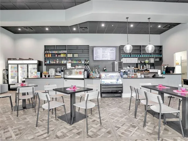 a kitchen with a dining table and chairs