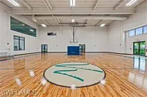 a indoor swimming pool with a table and chairs
