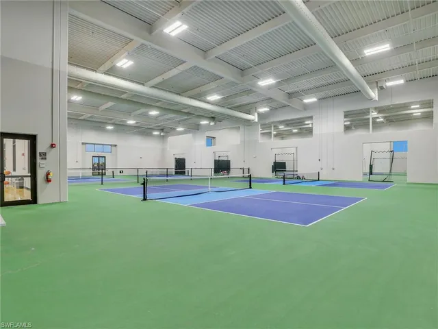 a view of an empty room with kitchen