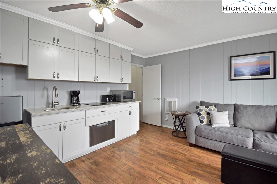 301 Pinnacle Inn Road, Unit 3130 Beech Mountain, NC 28604 - Photo 17 of 41 a living room with furniture and a fireplace