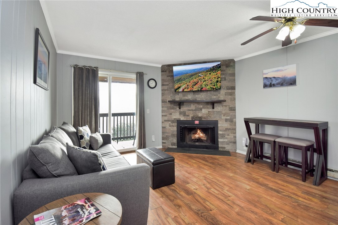 301 Pinnacle Inn Road, Unit 3130 Beech Mountain, NC 28604 - Photo 5 of 41 a living room with furniture and a fireplace