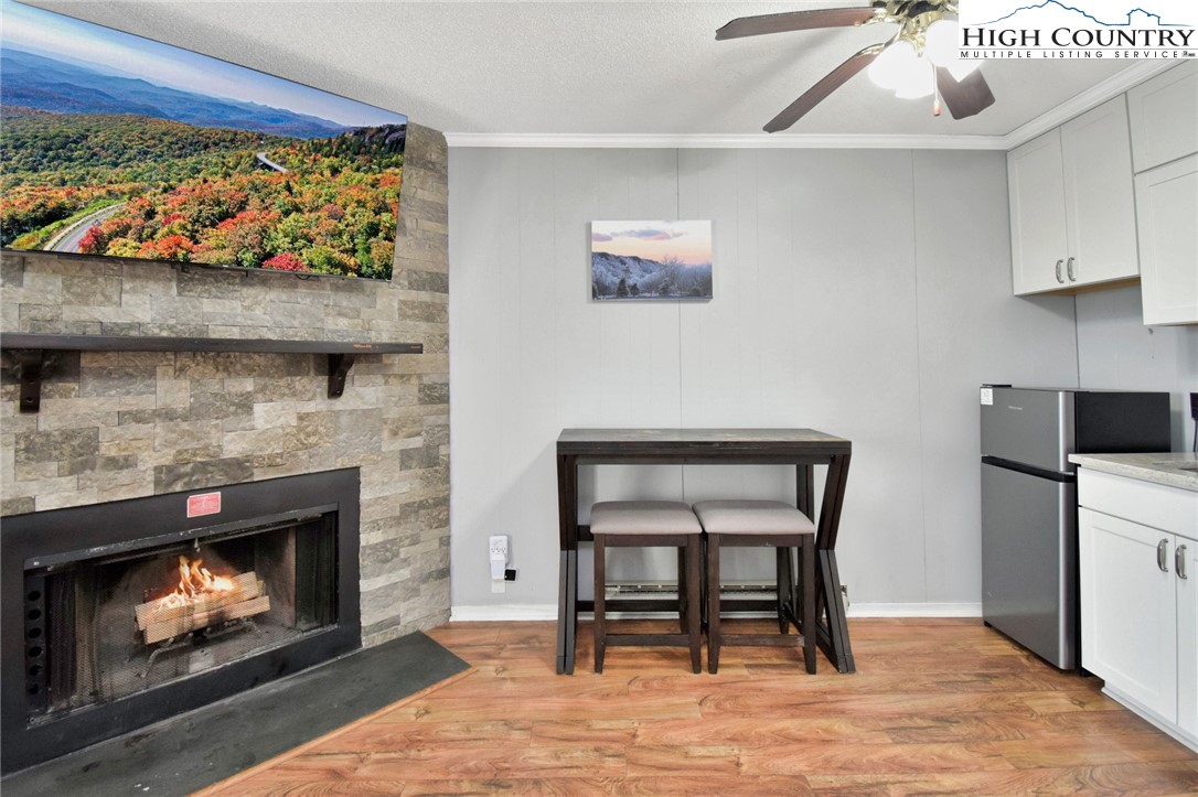 301 Pinnacle Inn Road, Unit 3130 Beech Mountain, NC 28604 - Photo 8 of 41 a living room with furniture and a fireplace
