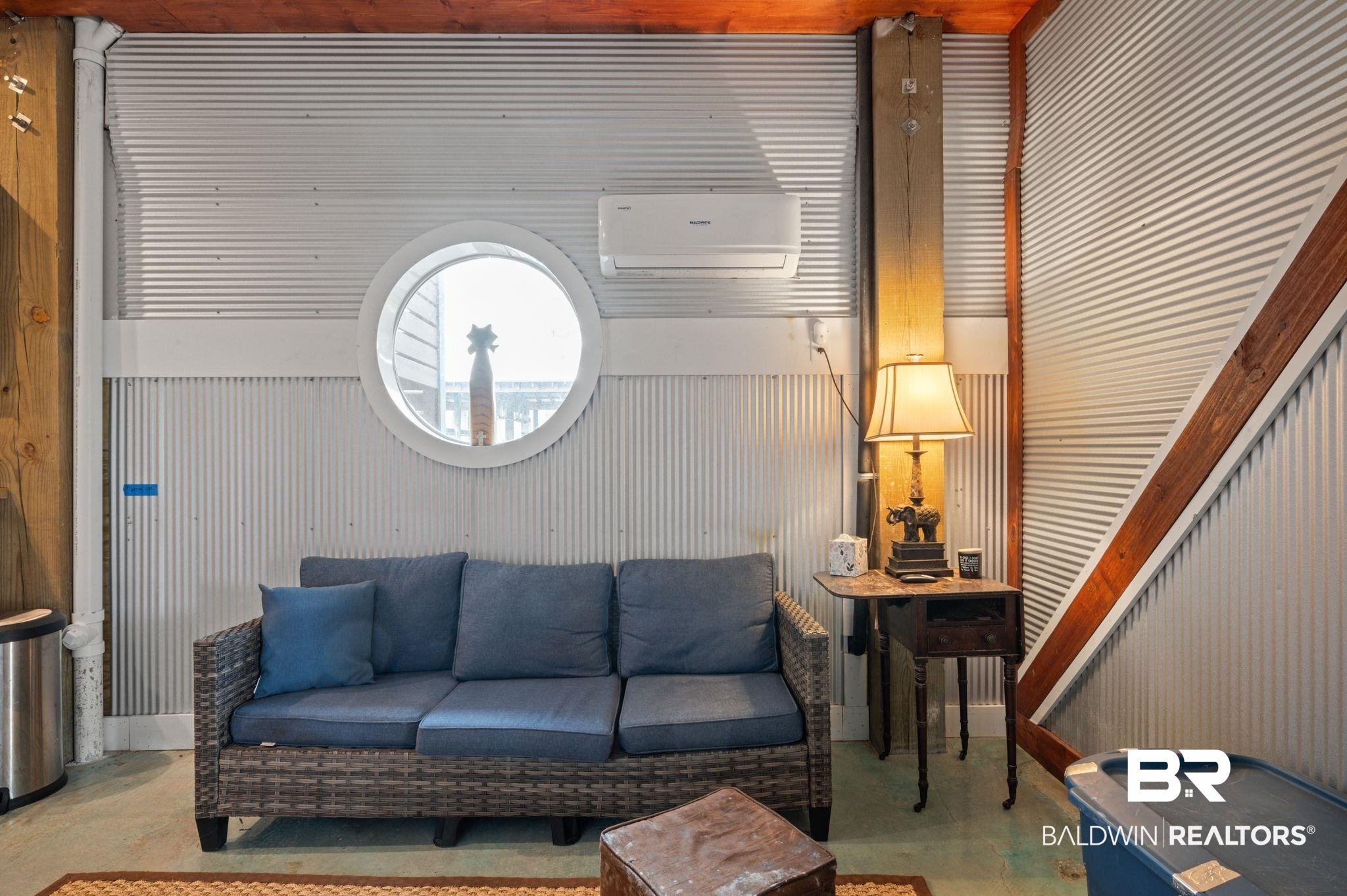 3840 Cotton Way Orange Beach, AL 36561 - Photo 55 of 75 Living room with a wall unit AC and concrete flooring