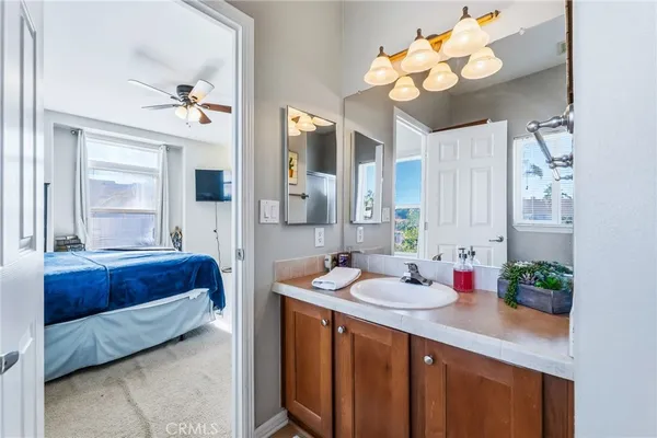 a spacious bathroom with a double vanity sink and a mirror