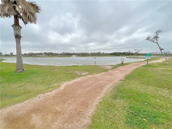 a view of a lake with a big yard