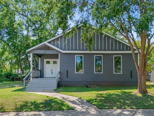 front view of a house with a yard