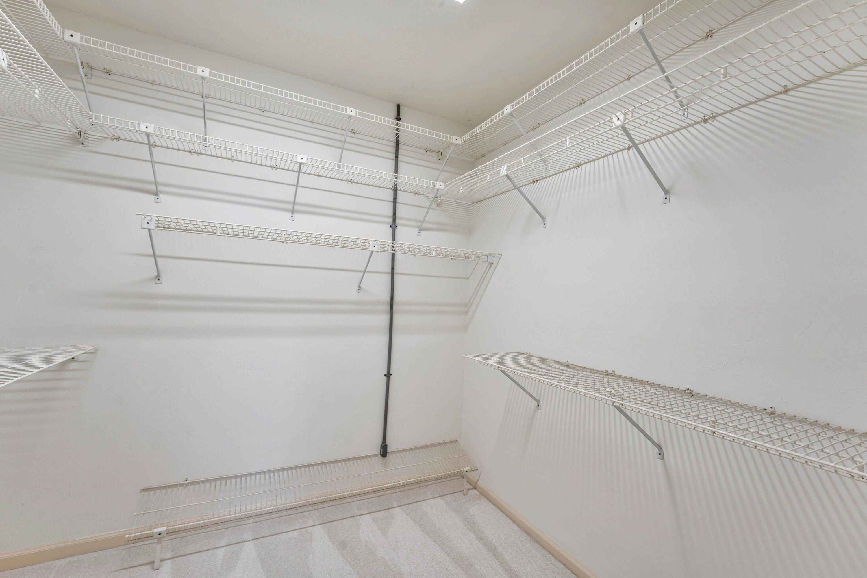 1851 Thatch Palm Drive Boca Raton, FL 33432 - Photo 39 of 70 a view of walk in closet with empty racks