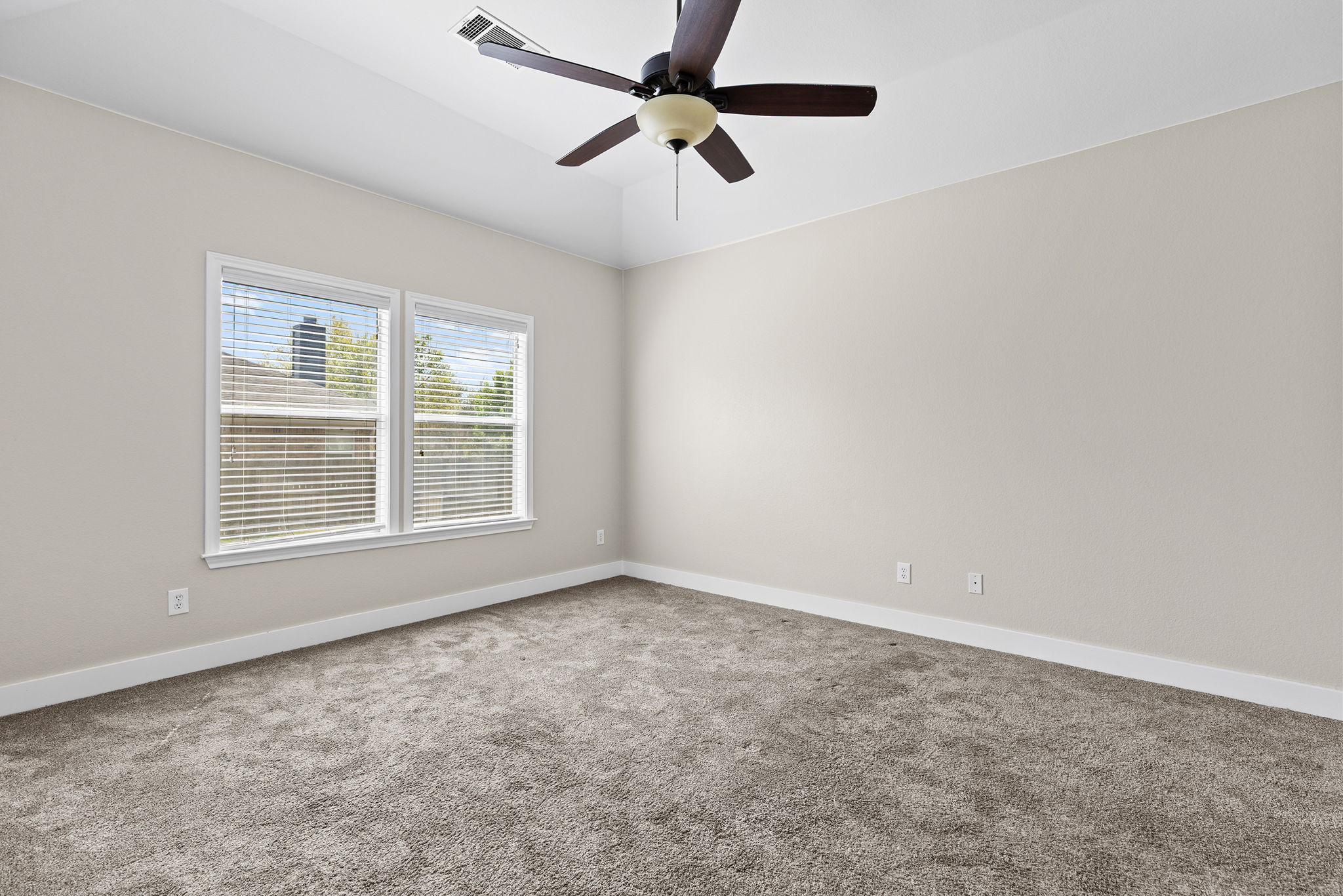 3013 Hawks Swoop Trail Pflugerville, TX 78660 - Photo 18 of 40 Empty room featuring carpet, a ceiling fan, and vaulted ceiling