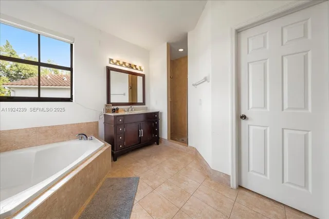 a bathroom with a toilet and a bathtub