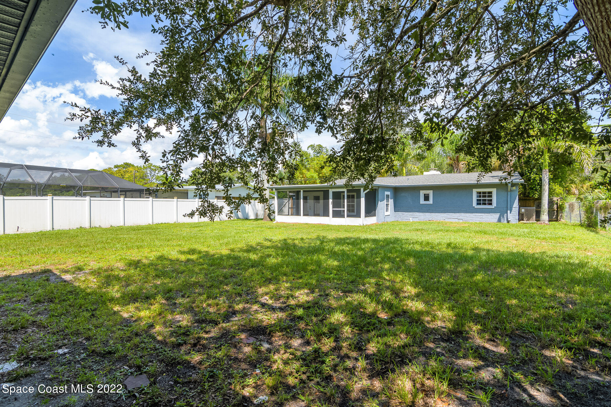 1861 Trimble Road Melbourne, FL 32934 - Photo 45 of 46 a front view of house with yard and green space