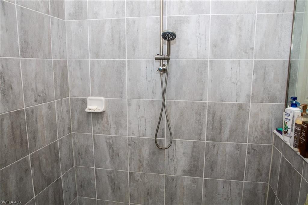 11726 Canopy Loop Fort Myers, FL 33913 - Photo 17 of 40 Full bath with a tile shower
