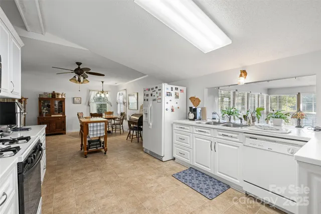 a view of a kitchen and dining room