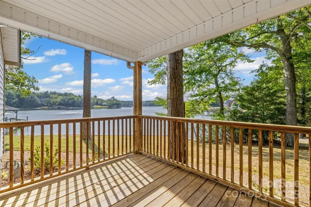 a view of a two chairs in the balcony