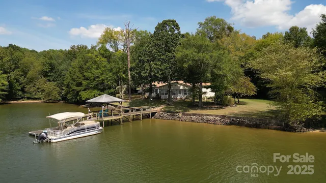 a view of a lake with boats and trees