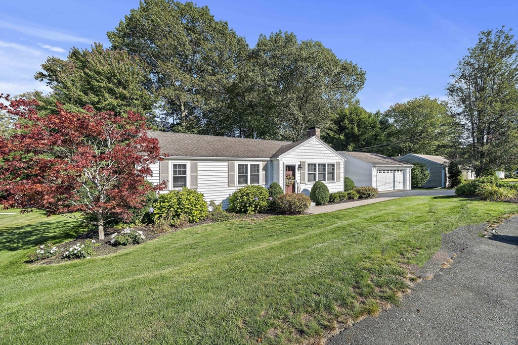 12 Dix Road Woburn, MA 01801 - Photo 1 of 33 a front view of a house with garden
