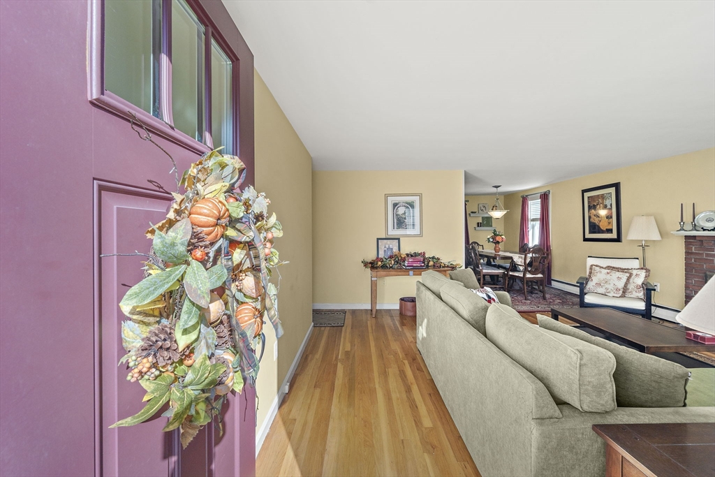 12 Dix Road Woburn, MA 01801 - Photo 2 of 33 a living room with furniture and a potted plant