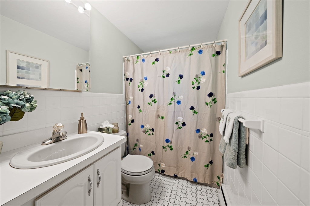 12 Dix Road Woburn, MA 01801 - Photo 21 of 33 a bathroom with a sink toilet and shower