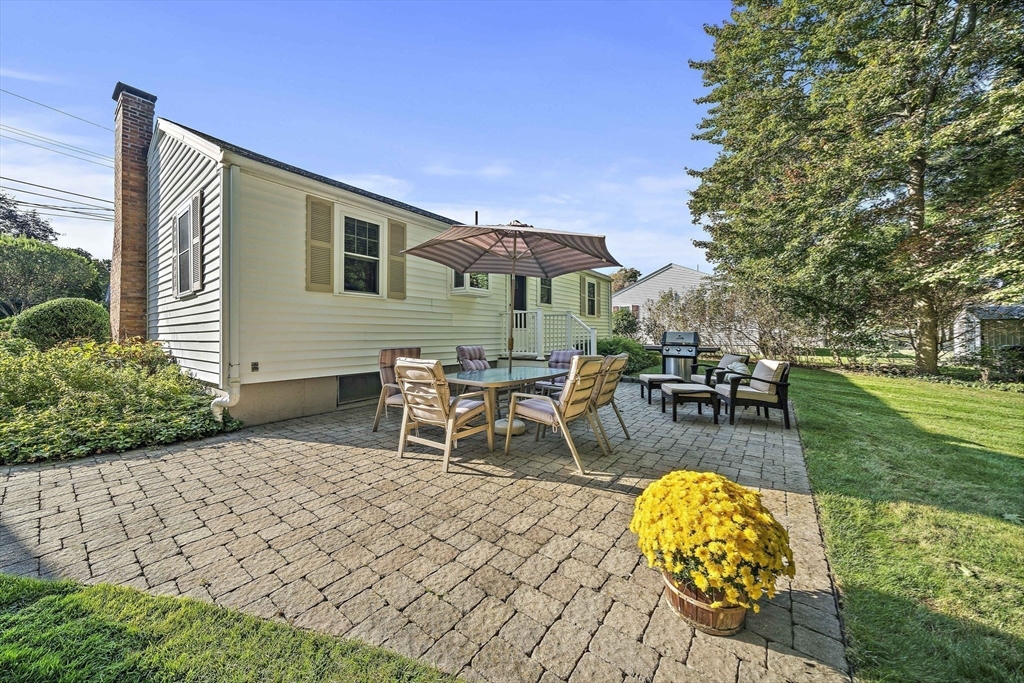 12 Dix Road Woburn, MA 01801 - Photo 29 of 33 a view of a backyard with a table and chairs