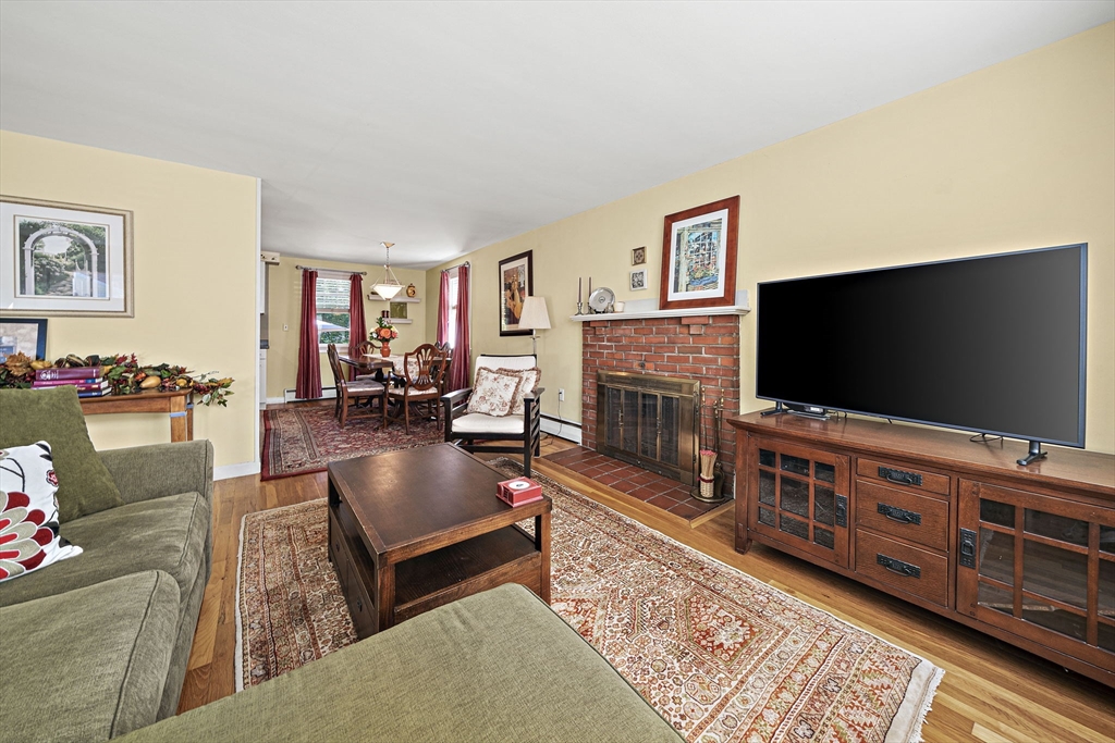 12 Dix Road Woburn, MA 01801 - Photo 3 of 33 a living room with furniture and a flat screen tv