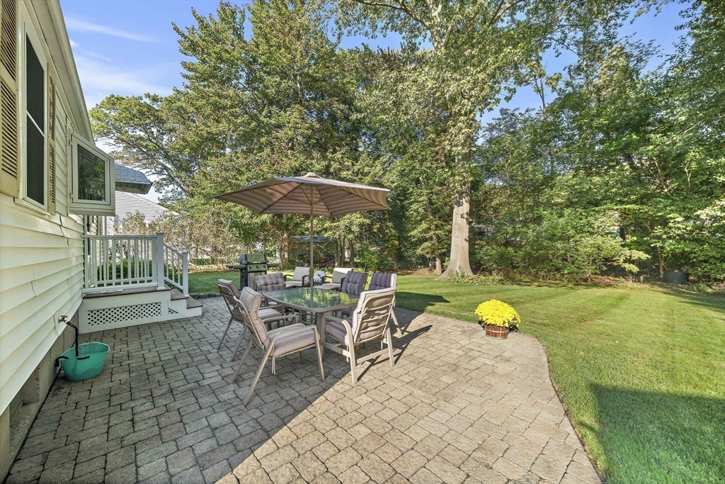 12 Dix Road Woburn, MA 01801 - Photo 32 of 33 a view of a swimming pool with a patio and a yard