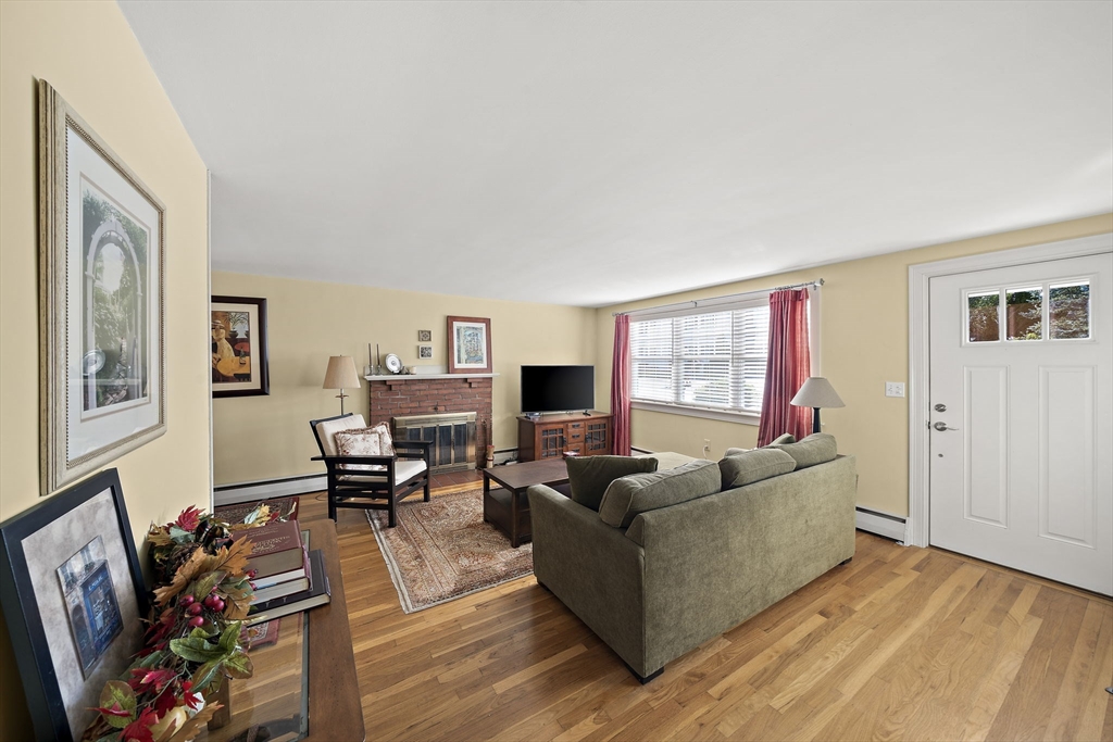 12 Dix Road Woburn, MA 01801 - Photo 4 of 33 a living room with furniture and wooden floor