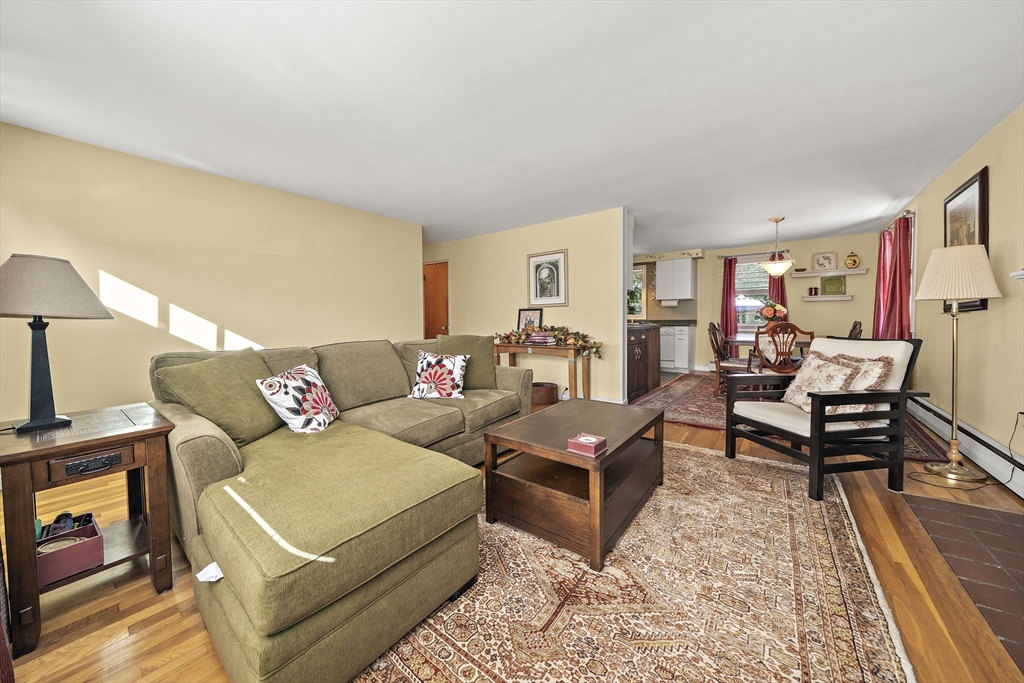 12 Dix Road Woburn, MA 01801 - Photo 6 of 33 a living room with furniture and a rug