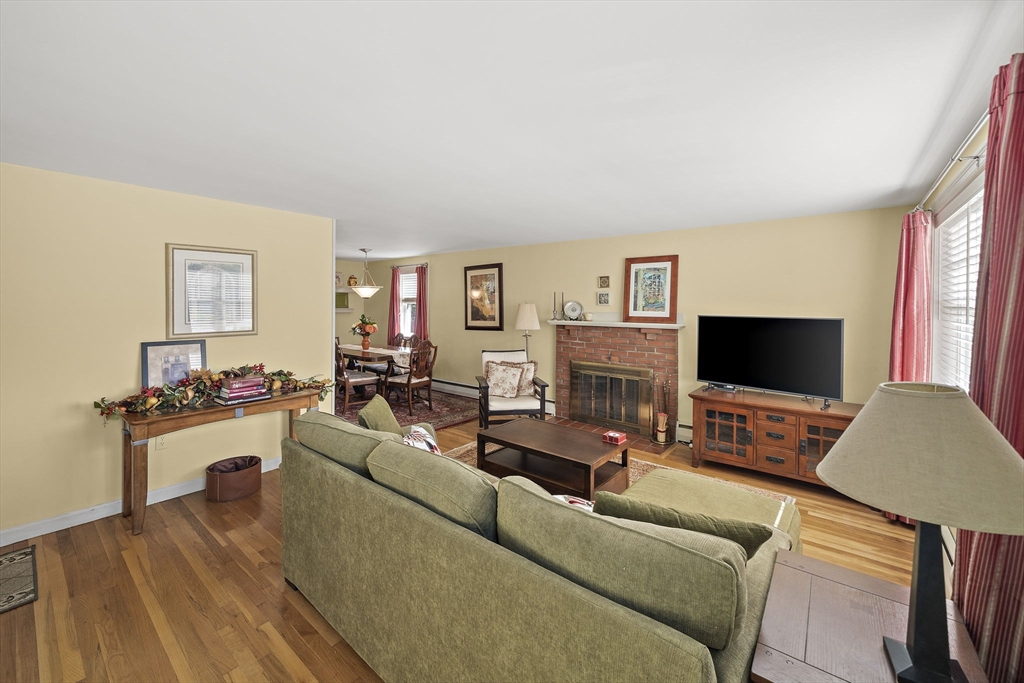 12 Dix Road Woburn, MA 01801 - Photo 7 of 33 a living room with furniture and a flat screen tv