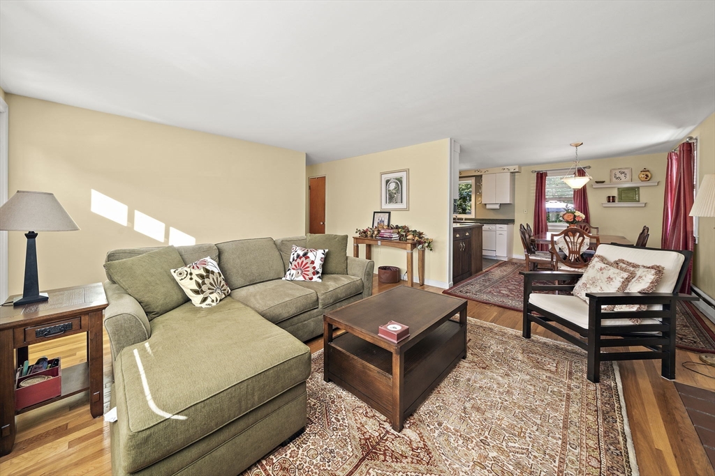 12 Dix Road Woburn, MA 01801 - Photo 8 of 33 a living room with furniture and a wooden floor