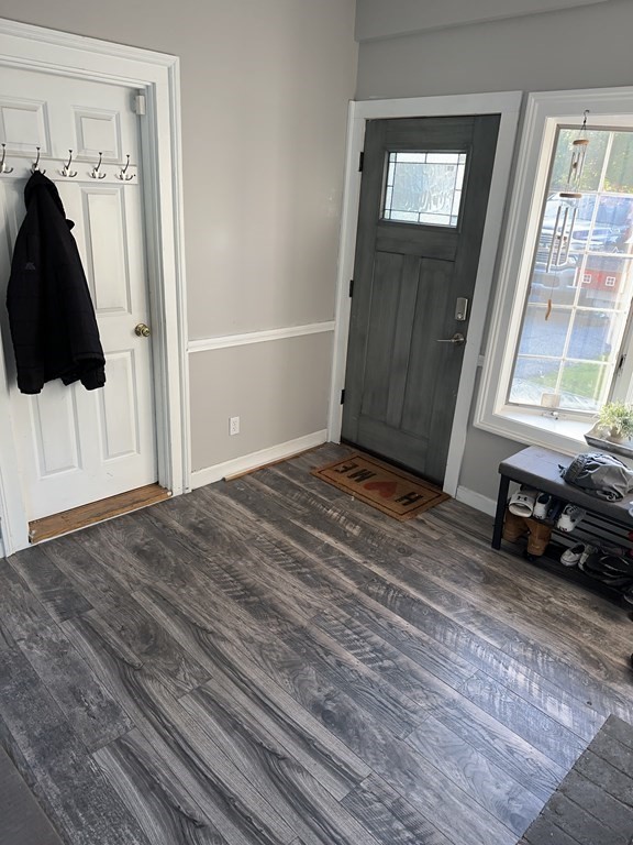 129 Conant Street Danvers, MA 01923 - Photo 13 of 14 a view of a livingroom with wooden floor and a window