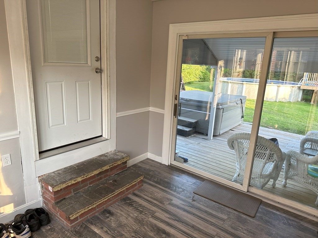 129 Conant Street Danvers, MA 01923 - Photo 14 of 14 a living room with a floor to ceiling window and wooden floor